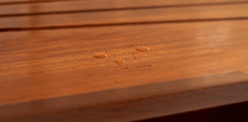 Fully protected wooden worktop with water beading on the surface